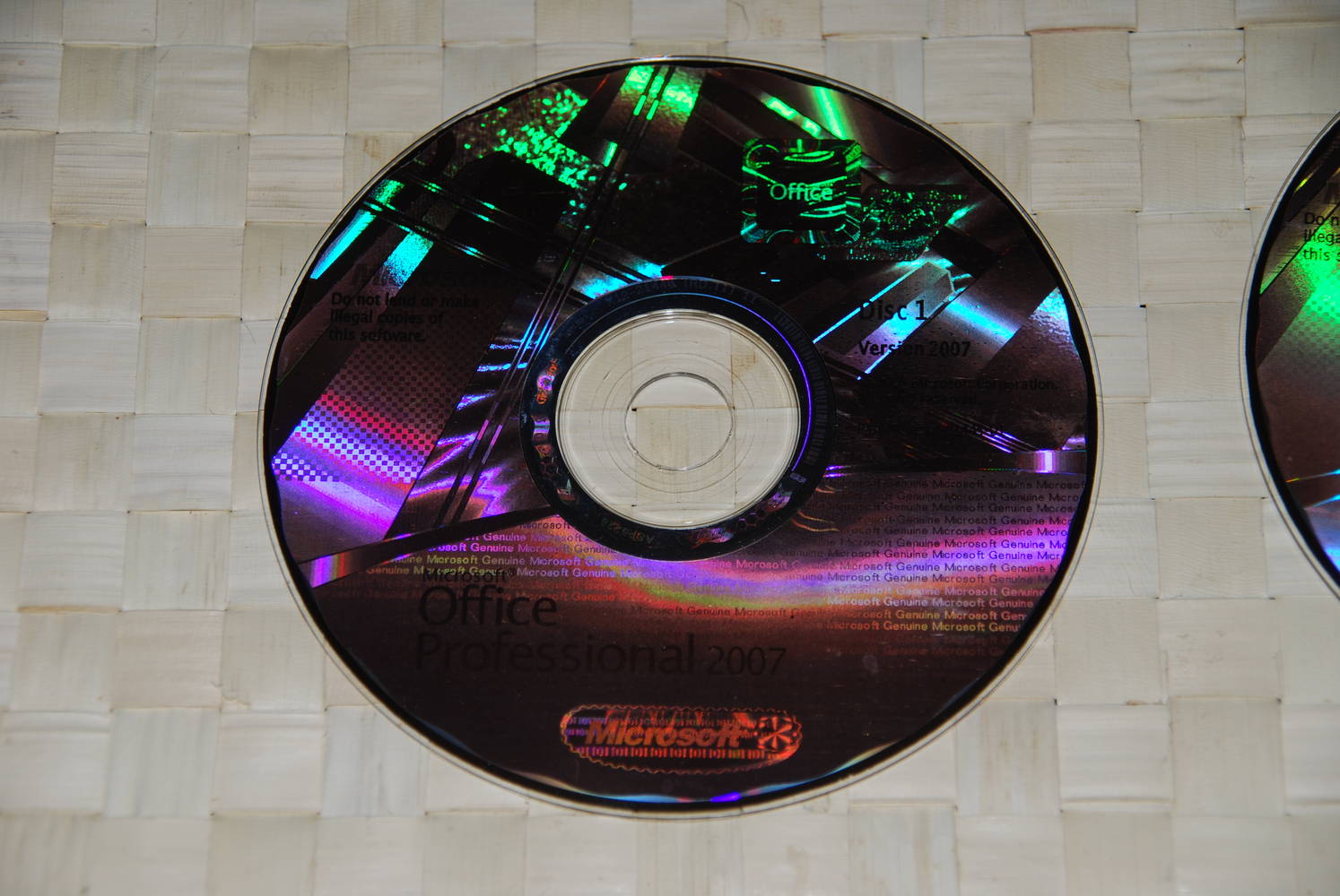 A close up of the disc (what the picture doesn't show are the slight blotches/uneven finish you don't find on genuine discs!)