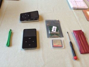 The 128GB Compact Flash card, the CF to ZIF adaptor board, the donor iPod, and the tools to open the iPod itself.  